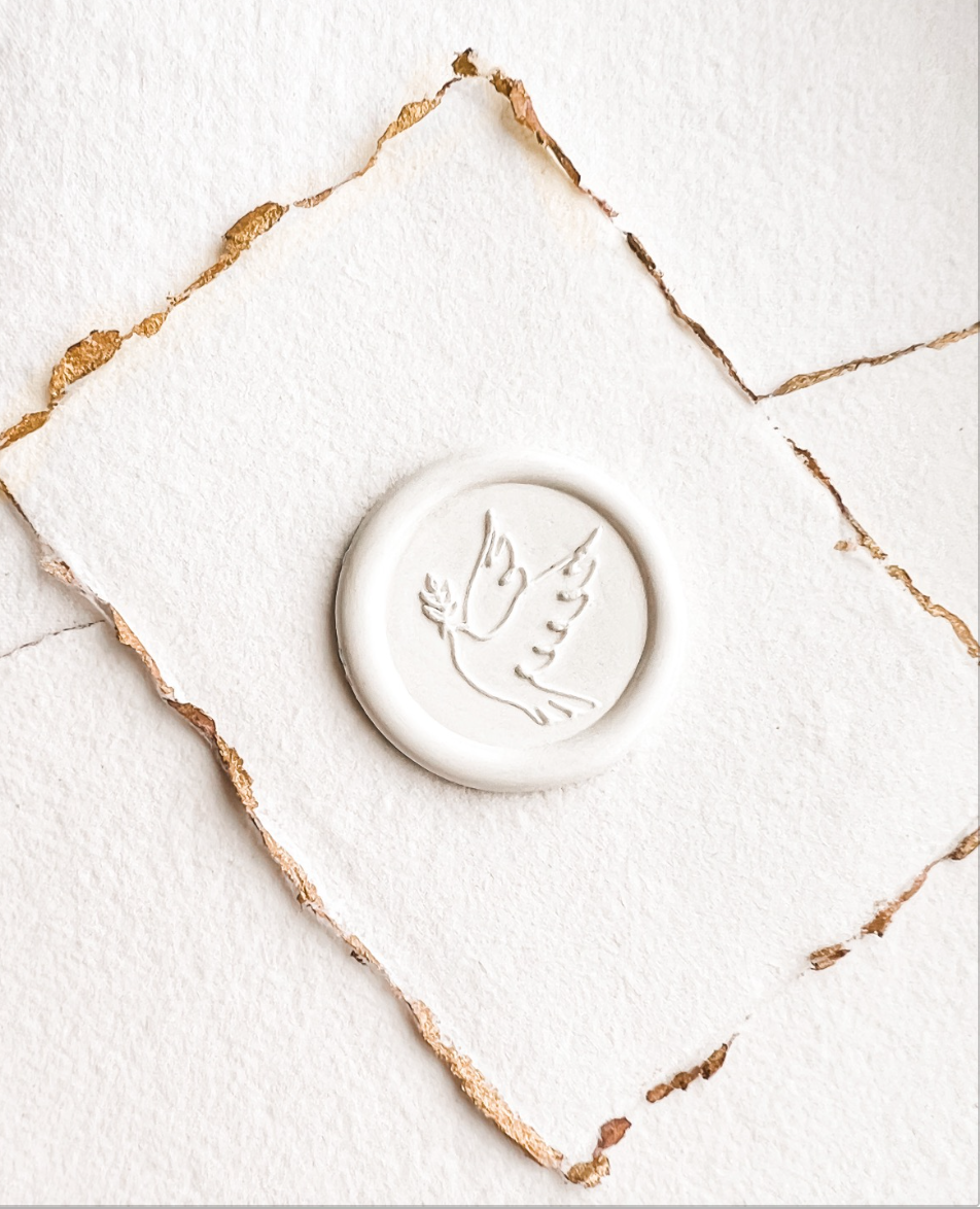 Catholic wax seals feauring a Holy Spirit dove with an olive branch.